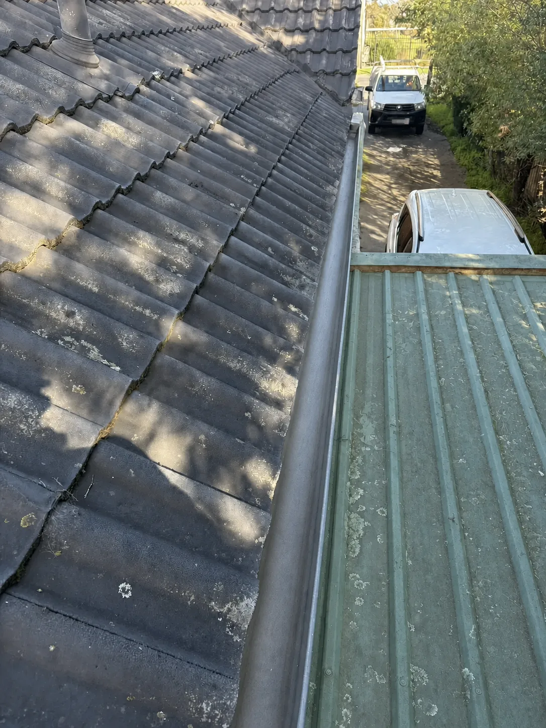Same gutter between tiled and metal roof sections clear after cleaning