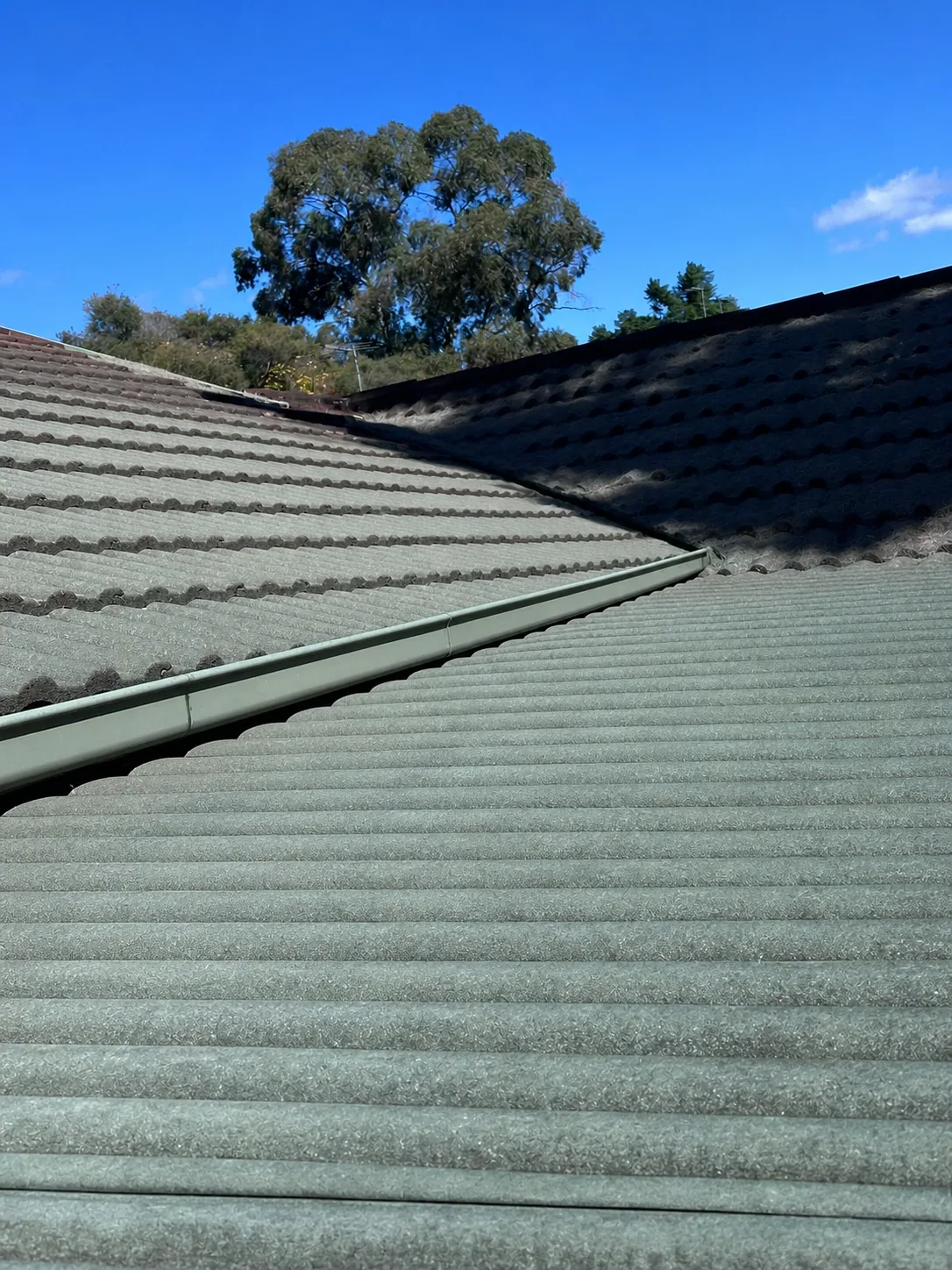 Matching after view of the cleared tiled roof surfaces and channels